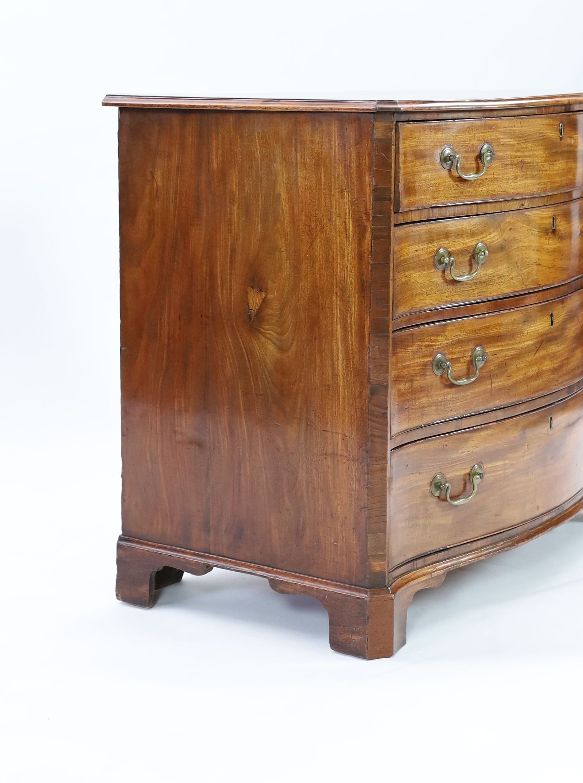 A George III mahogany serpentine dressing chest, W.101cm D.56cm H.84cm